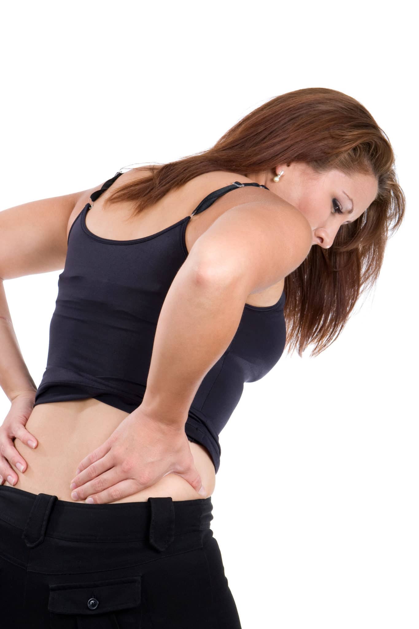 Woman bends over in pain rubbing her lower back as a result of a spinal injury accident.