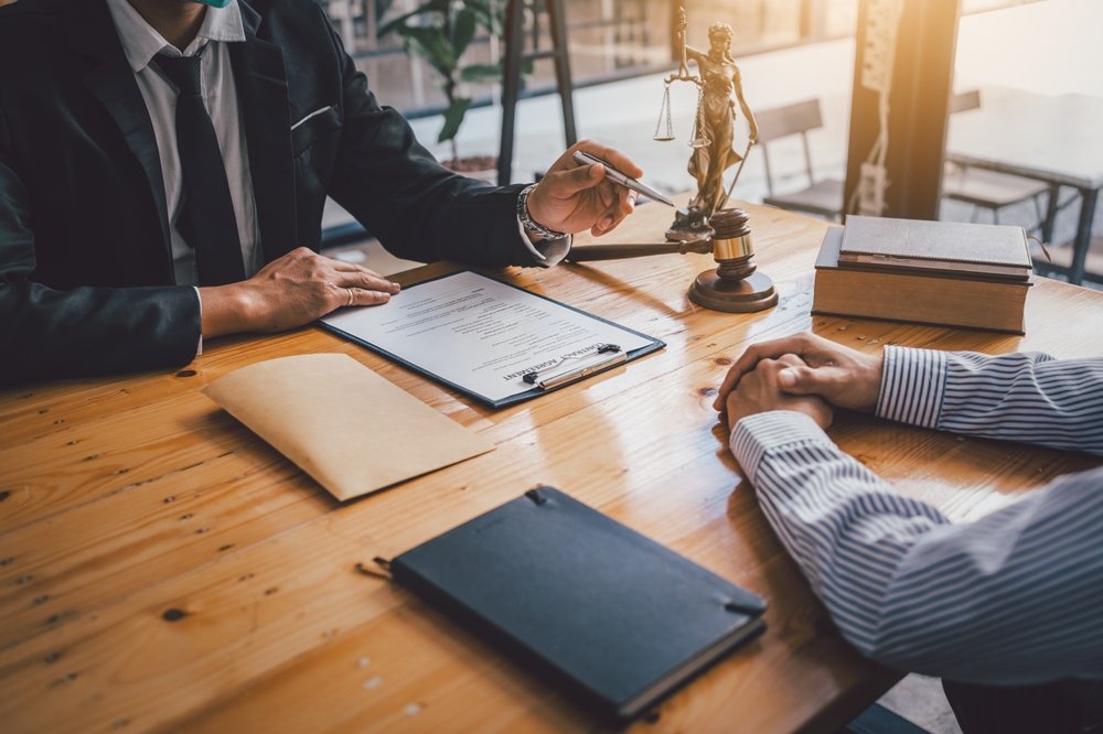 A lawyer discussing a comparative negligence case with a client