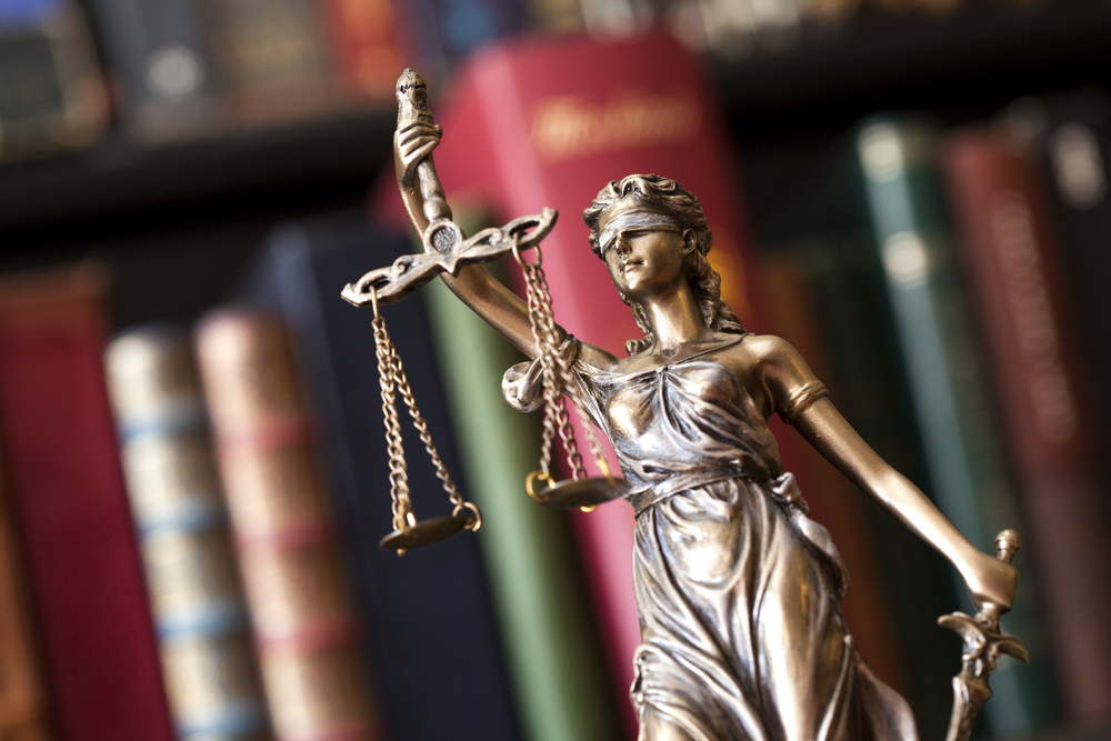 Statue of justice representing fairness in comparative negligence cases